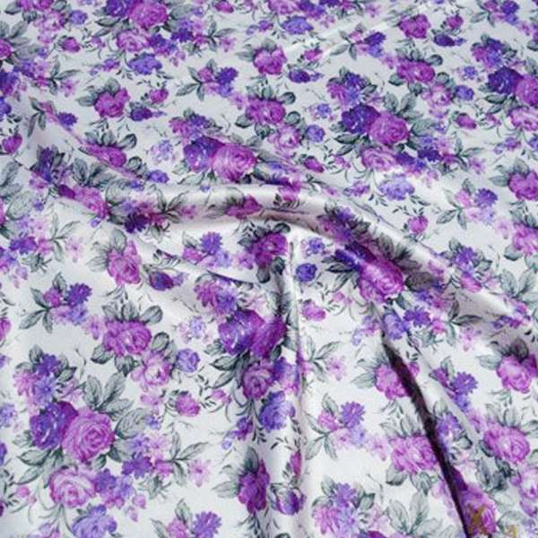 Атлас стрейч шамус білий з бузково-фіолетовими квітами ш.150 оптом