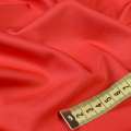 Тканина костюмна бістрейч червоно-помаранчева ш.150 оптом