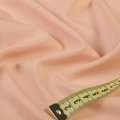Ткань костюмная бистрейч персиковая ш.150 оптом