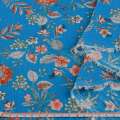 Вискоза жатая голубая, оранжевые цветы, ш.135 оптом