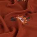 Вискоза жатая терракотовая, оранжевые цветы, ш.137 оптом