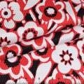Жаккард стрейч чорний в червоно-білі квіти ш.130 оптом