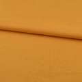 Трикотаж на флисе желто-оранжевый ш.190 оптом