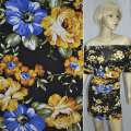 Трикотаж вискозный стрейч черный с желто-синими цветами ш.150 оптом