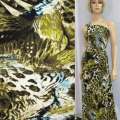 Трикотаж вискозный стрейч песочный с коричнево-желтыми перьями и леопардовым принтом ш.150 оптом