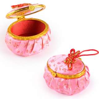 Шкатулка для ювелирных украшений тканевая овальная 9х7х5 см розовая оптом