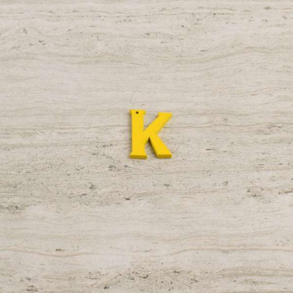 Пришивний декор літера K жовта, 25мм оптом